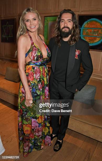 Heidi Klum and Tom Kaulitz attend the LA launch dinner for the Green Carpet Fashion Awards at San Vicente Bungalows on March 24, 2022 in West...
