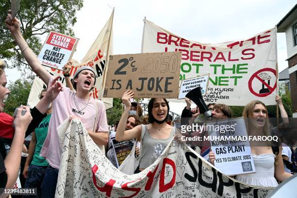 Schoolchildren shout slogans as they march towards the prime minister's house in Sydney on March 25 during a strike and protest by students...