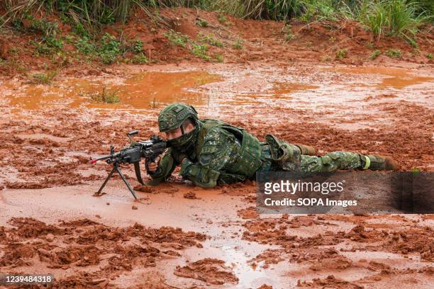 Soldier is in a prone position while aiming the target during the Army Special Aviation Department Tactical Mission Training session at a camp base...