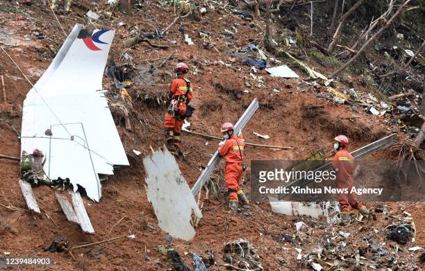 Rescuers conduct search and rescue work at a plane crash site in Tengxian County, south China's Guangxi Zhuang Autonomous Region, March 24, 2022....
