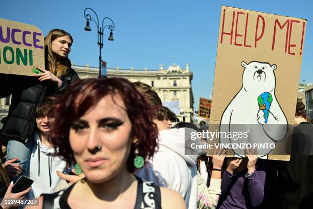 Climate activists from the 'Fridays for Future' movement take part in a protest march against profit, on March 25, 2022 in Rome's central Piazza...