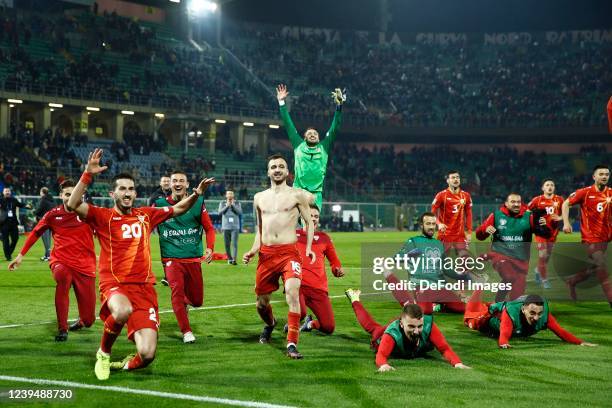 North Macedonia players celebrate after winning the 2022 FIFA World Cup Qualifier knockout round play-off match between Italy and North Macedonia at...