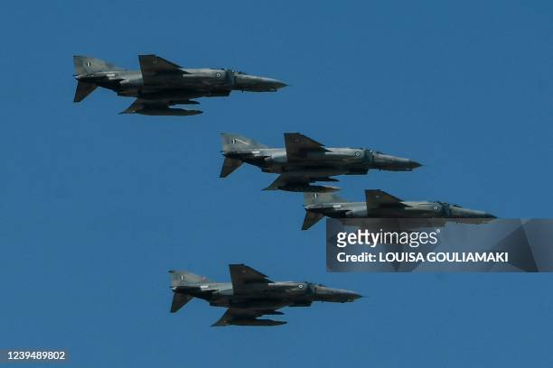 Greek airforce fighter jets take part during the Independence Day parade in Athens on March 25, 2022. - The March 25th national holiday marks the...