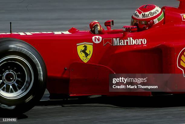 Eddie Irvine of Great Britain and Ferrari in action at the Malaysian Formula One Grand Prix at Sepang, Kuala Lumpur, Malaysia. Irvine won the race...