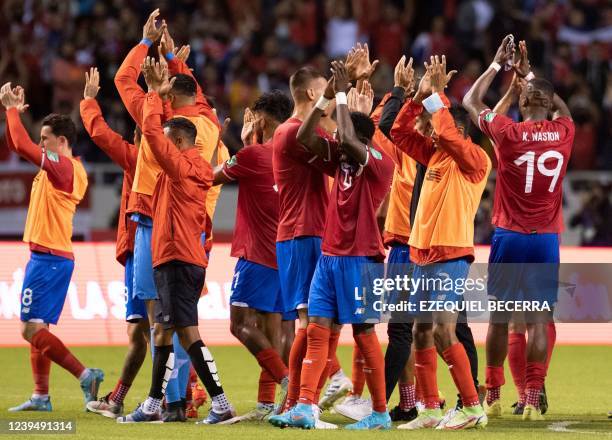 Costa Rica's players celebrate at the end of their FIFA World Cup Qatar 2022 Concacaf qualifier match against Canada at the National Stadium in San...