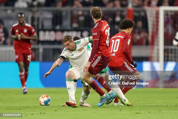 Bastian Oczipka of 1.FC Union Berlin, Kevin Moehwald of 1.FC Union Berlin, Thomas Mueller of Bayern Muenchen and Leroy Sane of Bayern Muenchen battle...