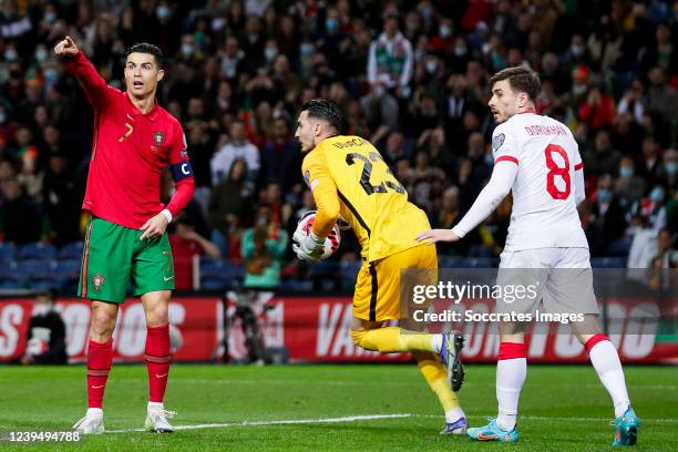 Cristiano Ronaldo of Portugal, Ugurcan Cakir of Turkey, Dorukhan Tokoz of Turkey during the EURO Qualifier match between Portugal v Turkey at the...