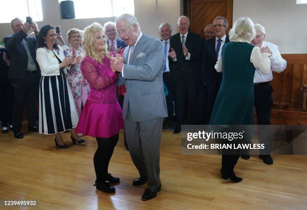 Britain's Camilla, Duchess of Cornwall and Britain's Prince Charles, Prince of Wales dance at the Bru Boru Cultural Centre in Cashel, County...