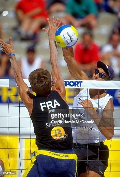 Jodard of France blocks Martinez of Argentina during the FIVB Beach Volleyball World Championships held at the Plages du Prado in Marseilles, France....