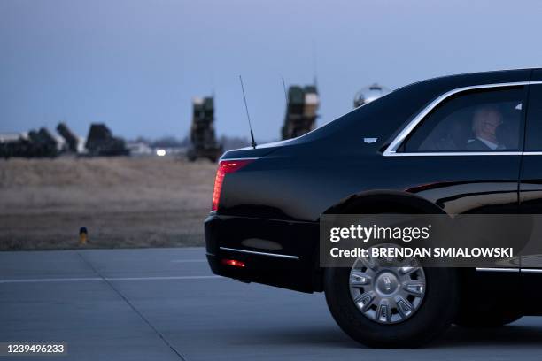 Anti-aircraft batteries are seen as a motorcade with US President Joe Biden drives to Air Force One at Rzeszow-Jasionka Airport, southeastern Poland,...