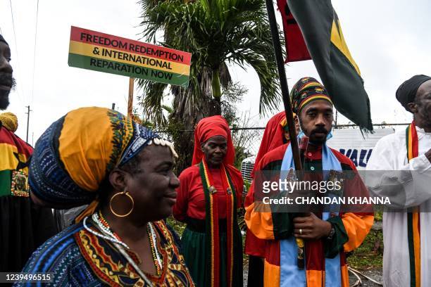 Members of Ethiopia Africa Black International Congress Church protest the visit of Britain's Prince Williams and Catherine the Duchess of Cambridge...