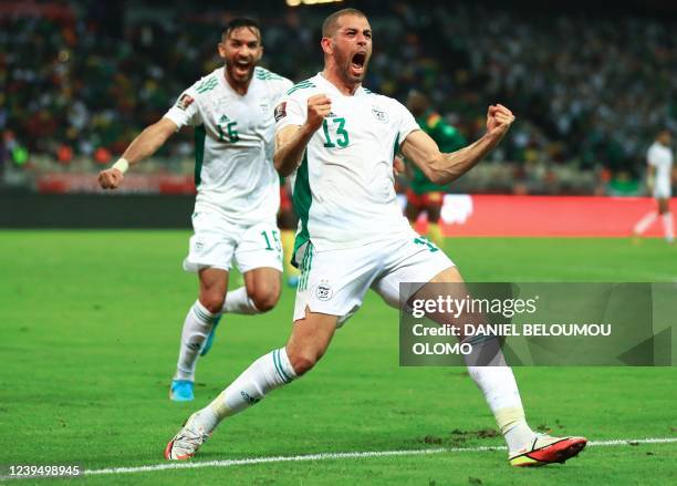 Algeria's Islam Slimani celebrates a goal during the FIFA World Cup Qatar 2022 qualifying third round football match between Algeria and Cameroon at...