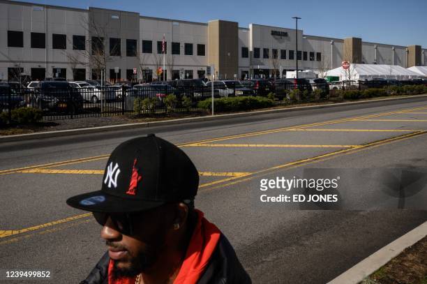 Amazon union leader Christian Smalls waits as workers cast their vote over whether or not to unionize, outside an Amazon warehouse in Staten Island...