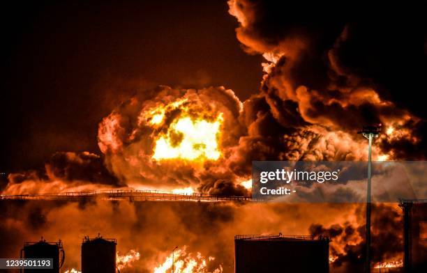 Smoke and flames rise from a Saudi Aramco oil facility in Saudi Arabia's Red Sea coastal city of Jeddah, on March 25 following a reported Yemeni...