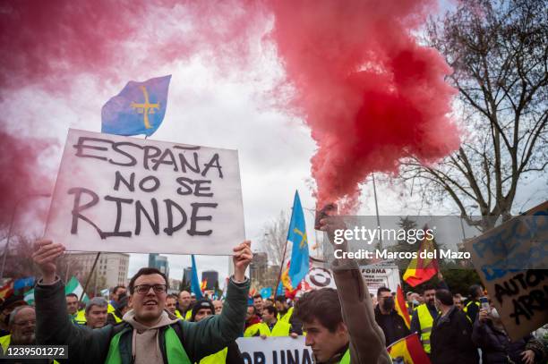 Truck drivers are seen protesting with smoke flares and placards near the Ministry of Transport during the 12th day of a national transportation...