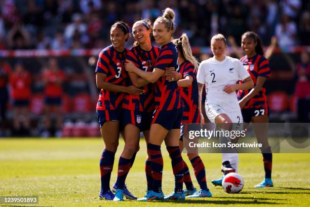 United States forward Ashley Hatch celebrates with United States forward Lynn Williams and United States midfielder Kristie Mewis during the She...