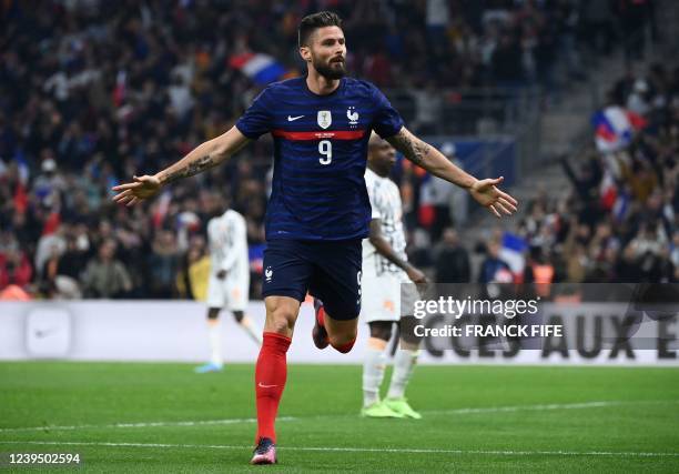France's forward Olivier Giroud celebrates after scoring a goal during the friendly football match between France and Ivory Coast at the Velodrome...