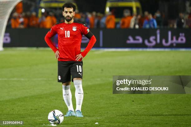 Egypt's forward Mohamed Salah stands over a free-kick during the 2022 Qatar World Cup African Qualifiers football match between Egypt and Senegal at...