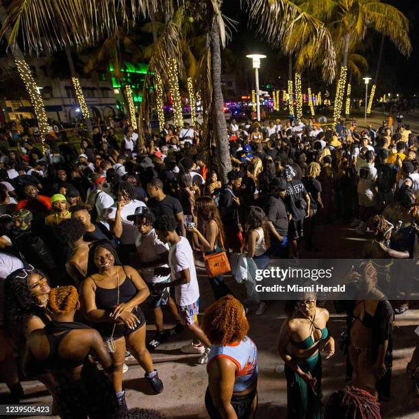 Crowds fill the beach walk along Ocean Drive during Spring Break in Miami Beach on March 19, 2022.