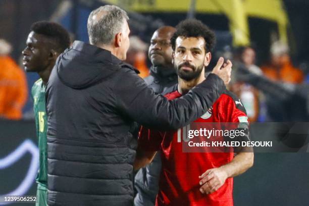 Egypt's coach Carlos Queiroz embraces his forward Mohamed Salah after winning the 2022 Qatar World Cup African Qualifiers football match between...