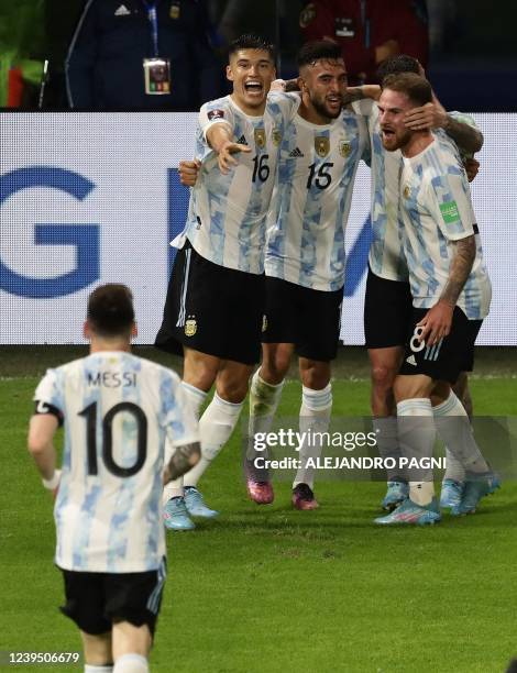 Argentina's Nicolas Gonzalez celebrates with teammates after scoring against Venezuela during their South American qualification football match for...