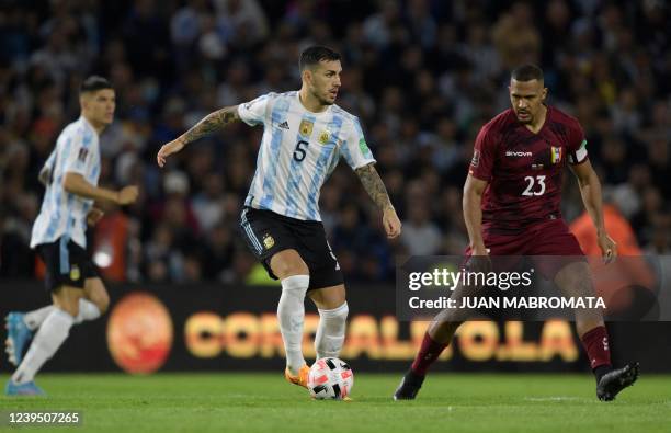 Argentina's Leandro Paredes controls the ball next to Venezuela's Salomon Rondon during the South American qualification football match for the FIFA...