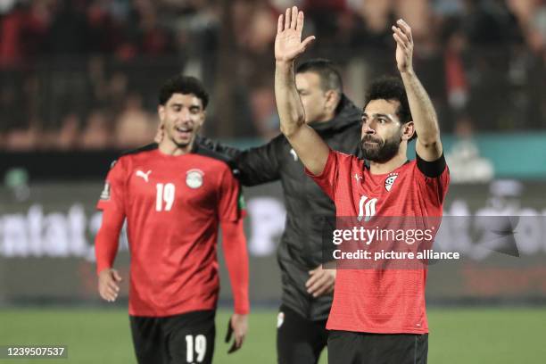 March 2022, Egypt, Cairo: Egypt's Mohamed Salah applauds the fans after the final whistle of the 2022 FIFA World Cup qualification third round 1st...