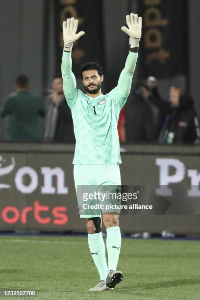 March 2022, Egypt, Cairo: Egypt goalkeeper Mohammed El Shenawy applauds the fans after the final whistle of the 2022 FIFA World Cup qualification...