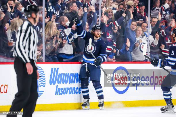 Kyle Connor of the Winnipeg Jets celebrates his first period goal against the Columbus Blue Jackets at the Canada Life Centre on March 25, 2022 in...