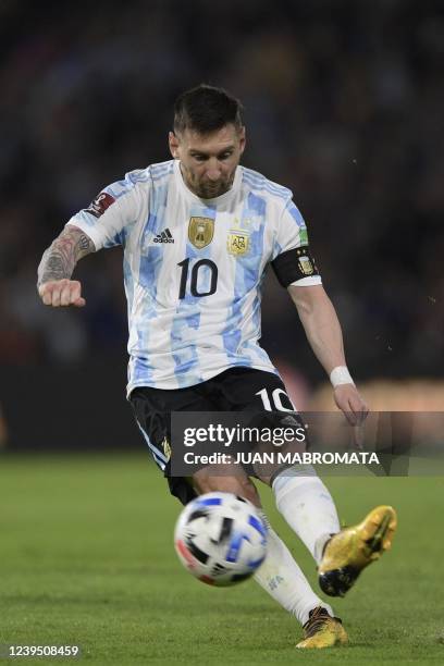 Argentina's Lionel Messi shoots a free kick against Venezuela during their South American qualification football match for the FIFA World Cup Qatar...