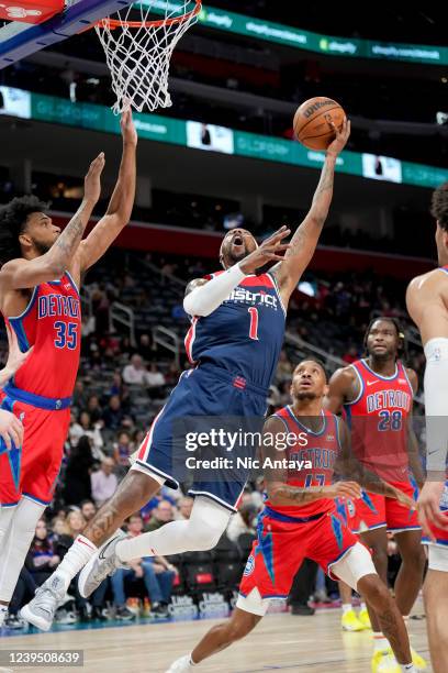 Kentavious Caldwell-Pope of the Washington Wizards shoots the ball against Marvin Bagley III and Rodney McGruder of the Detroit Pistonsduring the...