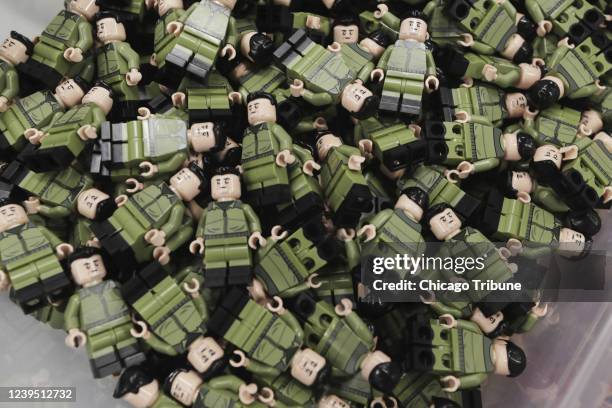 Bin full of minifigures of Ukrainian President Volodymyr Zelenskyy at Citizen Brick on March 21 in Naperville, Illinois.