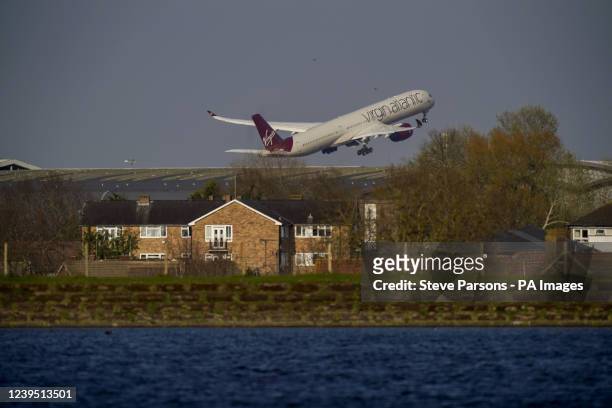 Virgin Atlantic plane takes off from Heathrow airport in West London. Picture date: Saturday March 26, 2022. Photo credit should read: Steve...