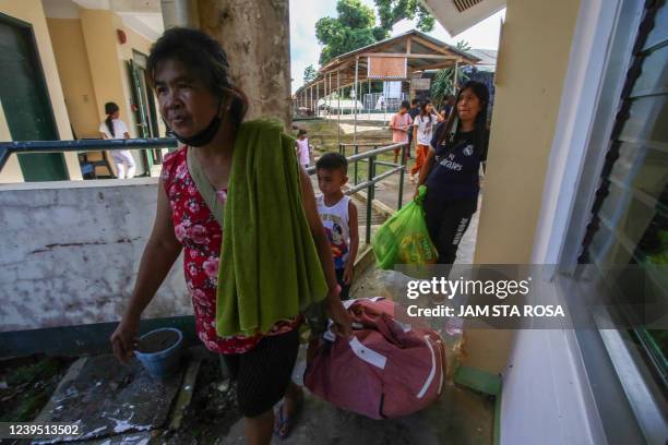 Residents living near Taal volcano evacuate to a public school in Laurel, Batangas, on March 26 after an eruption earlier in the morning sent ash and...