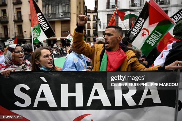 Demonstrators wave Western Sahara flags during a protest against the Spanish government support for Morocco's autonomy plan for Western Sahara, in...