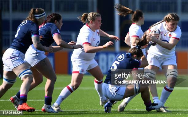 Scotland's lock Louise McMillan tackles England's flanker Poppy Cleall during the Six Nations international women's rugby union match between...