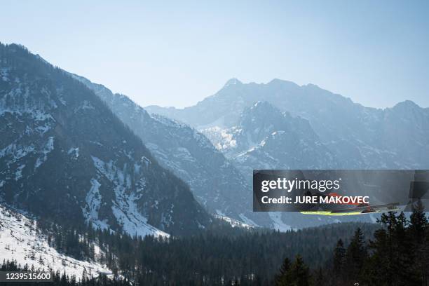 Switzerlands Simon Ammann competes during the FIS Ski Jumping World Cup Men Flying Hill Team competition in Planica on March 26, 2022.