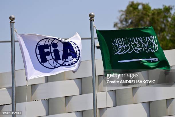 The flags of the Federation Internationale de l'Automobile and Saudi Arabia wave ahead of the third practice session ahead of the 2022 Saudi Arabia...