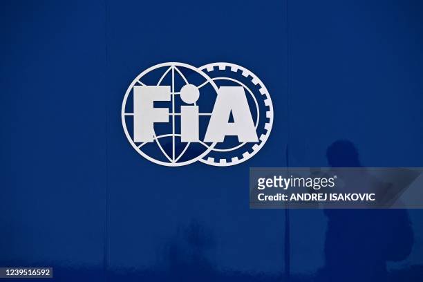 The silhouette of a man is reflected on the FIA logo before the start of the third practice session ahead of the 2022 Saudi Arabia Formula One Grand...