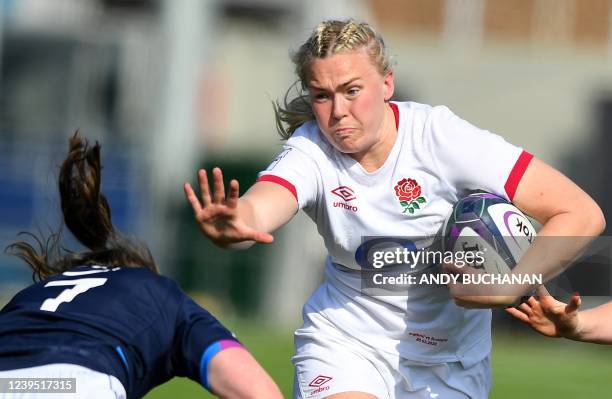 Scotland's flanker Rachel McLachlan attempts to tackle England's lock Rosie Galligan during the Six Nations international women's rugby union match...
