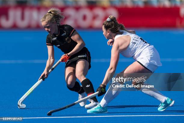 Emma Davidsmeyer of Germany and Megan Rodgers of Germany battle for the ball during the women´s FIH Pro League match between Germany and USA at...