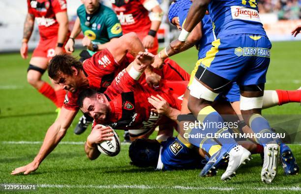 Toulon's French prop Jean-Baptiste Gros scores a try during the French Top 14 rugby union match between Toulon and Clermont Auvergne at the Mayol...