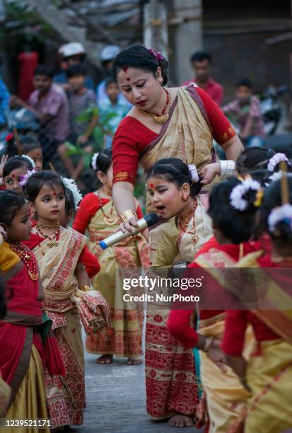 Children learning Bihu dance from a mentor in a traditional Bihu Dance workshop ahead of Rongali Bihu festival, in Guwahati, Assam, India on...