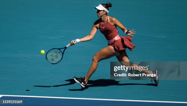Belinda Bencic of Switzerland hits a forehand against Heather Watson of Great Britain during her third round match on day 6 of the Miami Open at Hard...