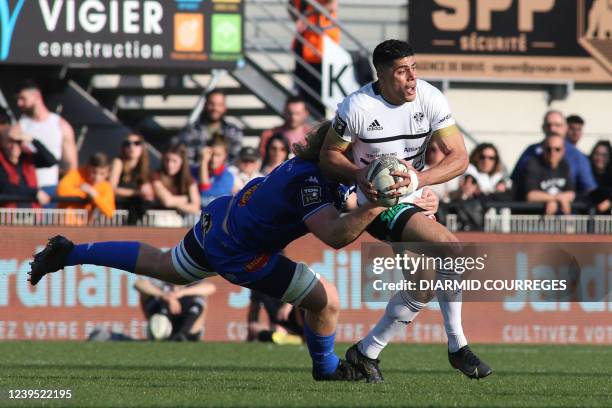 Brive's Argentinian wing Axel Muller Aranda is tackled during the French Top 14 rugby union match between Club Athletique Brive Correze Limousin and...