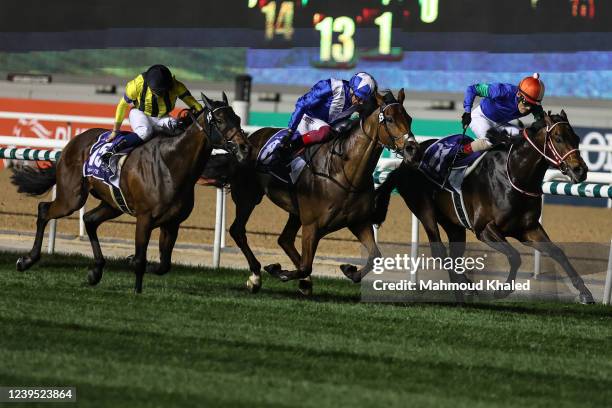 Lanfraco Dettori jockey of Lord North and Yutaka Yoshida jockey of anthalassa wins the Dubai Turf at the Meydan Racecourse on March 26, 2022 in...