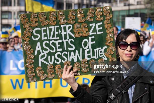 Ukrainian and British anti-War protesters march through central London against the Russian invasion of Ukraine, on 26th March 2022, in London,...