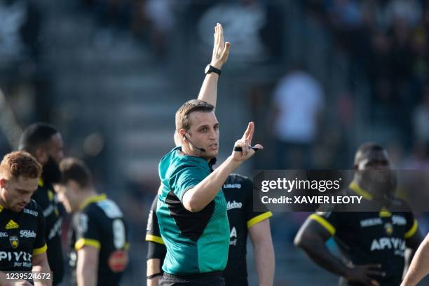 The referee Thomas Charabas gestures during the French Top14 rugby union match between Stade Rochelais and Racing 92 at the Marcel-Deflandre stadium...