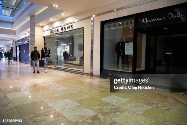 Shoppers go past closed Zara and Massimo Dutti stores at Afimall shopping mall on March 26, 2022 in Moscow, Russia. More than 400 companies have...