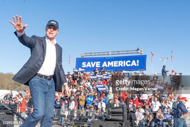 Former U.S. Senator and Republican candidate for Governor of Georgia David Perdue waves to supporters of former U.S. President Donald Trump after...